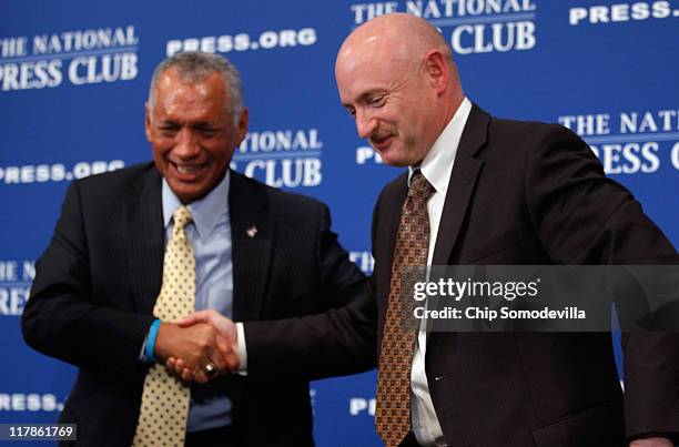 Administrator Charles Bolden Jr. And Astronaut and space shuttle commander Capt. Mark Kelly shake hands after both men addressed the National Press...