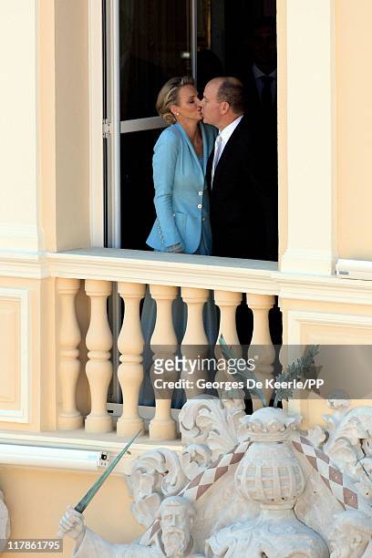 Princess Charlene of Monacoand Prince Albert II of Monaco kiss on the balcony after the civil ceremony of the Royal Wedding of Prince Albert II of...