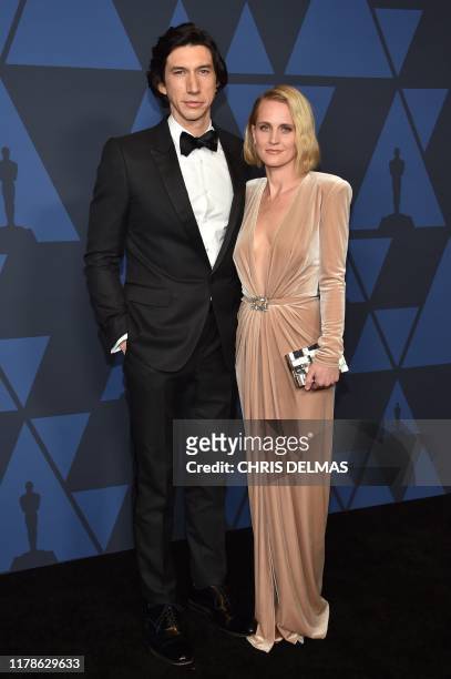 Actor Adam Driver and wife US actress Joanne Tucker arrive to attend the 11th Annual Governors Awards gala hosted by the Academy of Motion Picture...