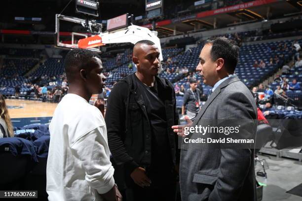 Minnesota United FC players Darwin Quintero and Angelo Rodriguez talk to Gersson Rosas prior to a game between the Miami Heat and Minnesota...