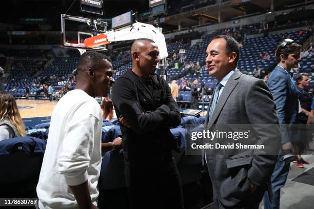 Minnesota United FC players Darwin Quintero and Angelo Rodriguez talk to Gersson Rosas prior to a game between the Miami Heat and Minnesota...