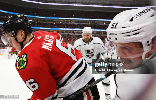 Chicago Blackhawks defenseman Olli Maatta and Los Angeles Kings left wing Austin Wagner battle for a loose puck in the first period on Sunday, Oct....