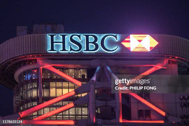 In this picture taken on October 24 shows a general view of the HSBC headquarters building in Hong Kong. - HSBC pre-tax profits slip 18 percent to...