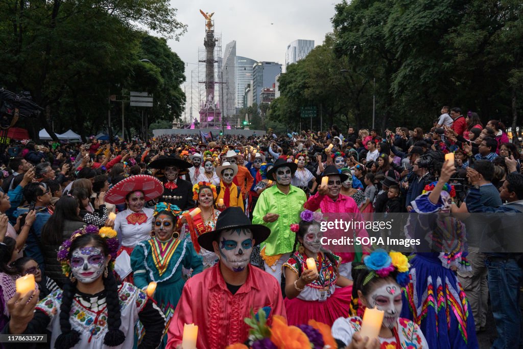 Participants in traditional costume and with their faces...