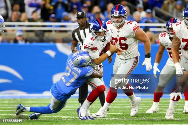 New York Giants quarterback Daniel Jones is taken down by Detroit Lions cornerback Justin Coleman during his attempt to run the ball during the...