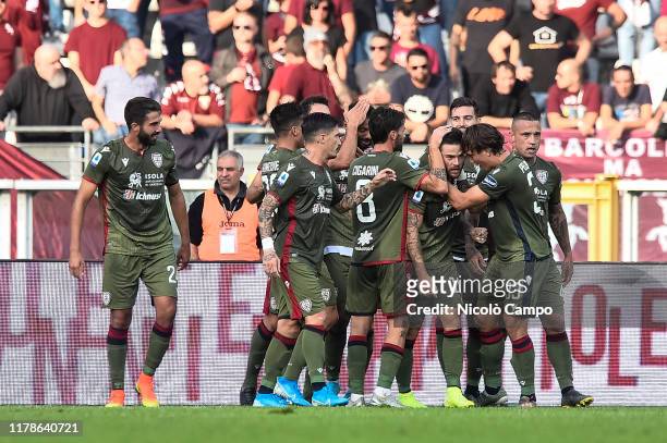 Nahitan Nandez of Cagliari Calcio celebrates with his teammates after scoring the opening goal during the Serie A football match between Torino FC...