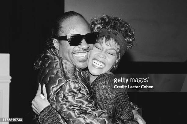 Whitney Houston and Stevie Wonder attend an event circa 1989.