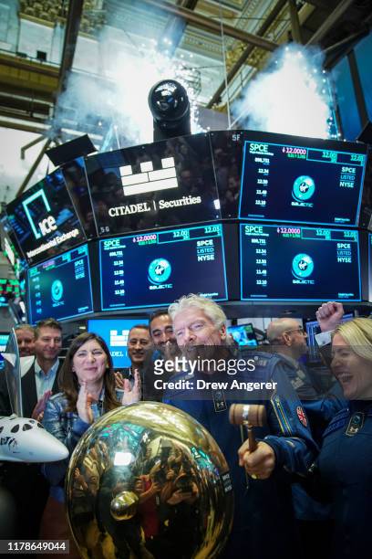Sir Richard Branson, Founder of Virgin Galactic, rings a ceremonial bell on the floor of the New York Stock Exchange to promote the first day of...