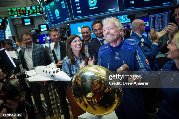 Sir Richard Branson, Founder of Virgin Galactic, rings a ceremonial bell on the floor of the New York Stock Exchange to promote the first day of...