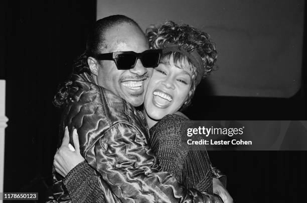 Whitney Houston and Stevie Wonder attend an event circa 1989.