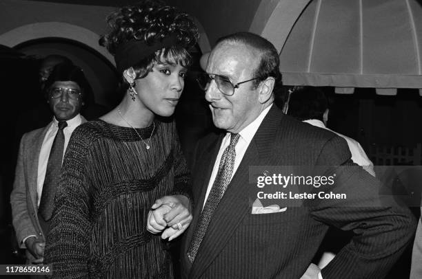 Whitney Houston and Clive Davis attend a party circa 1989.