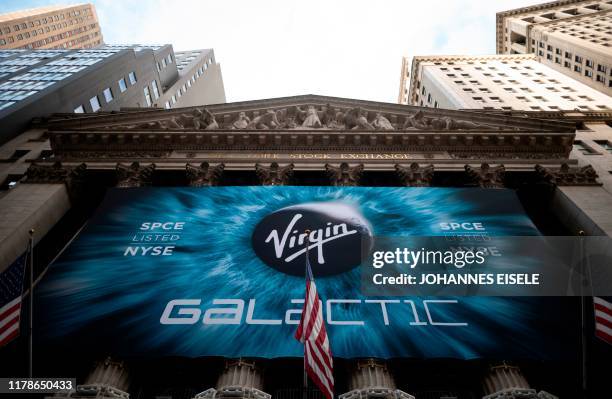 Logo of a Virgin Galactic is seen outside the building during the company's first day of trading on the New York Stock Exchange on October 28, 2019...