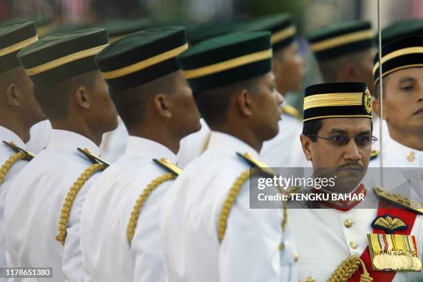 Malaysia's King Tuanku Mizan Zainal Abidin inspects a Royal Guard of Honour from the Royal Malay Regiment's 1st Battalion during Malaysia's 50th...