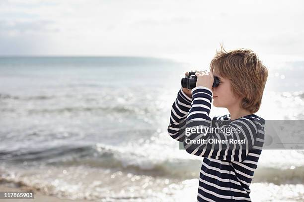 portrait of a young boy at the beach - boy exploring on beach stock pictures, royalty-free photos & images