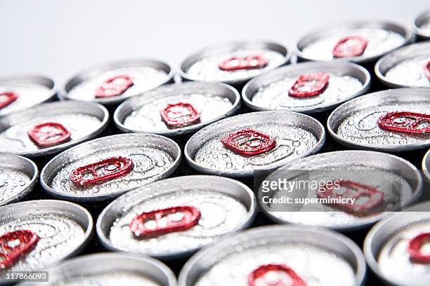 soda cans lined up with condensation on top - läskburk bildbanksfoton och bilder