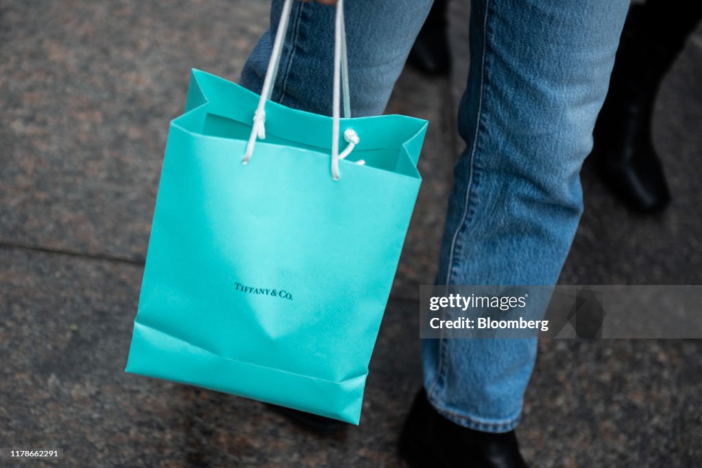 A shopper holds a bag from the Tiffany & Co. store on Fifth Avenue