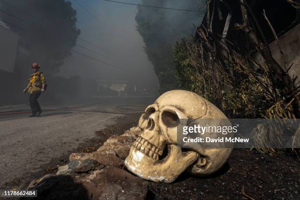 Halloween decorations sit out near the ruins of a house that burned in the Getty Fire on October 28, 2019 in Los Angeles, California. Reported at...