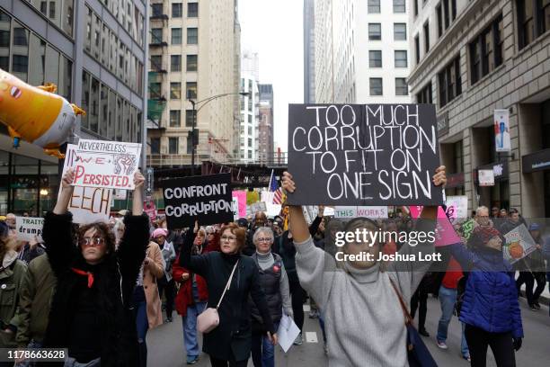 Demonstrators protest President Donald Trump's visit to Chicago outside Trump International Hotel & Tower on October 28, 2019 in Chicago, Illinois....