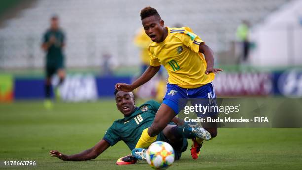 Raphael Leai of Solomon Islands struggles for the ball with Franco Tongya of Italy during the FIFA U-17 Men's World Cup Brazil 2019 group F match...