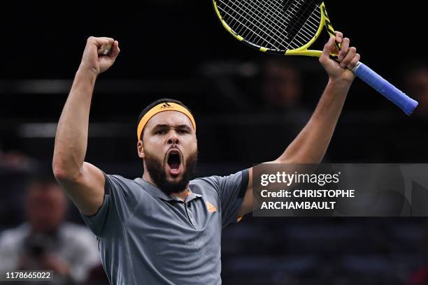 France's Jo-Wilfried Tsonga celebrates after winning against Russia's Andrey Rublev after their men's singles tennis match on day one of the ATP...