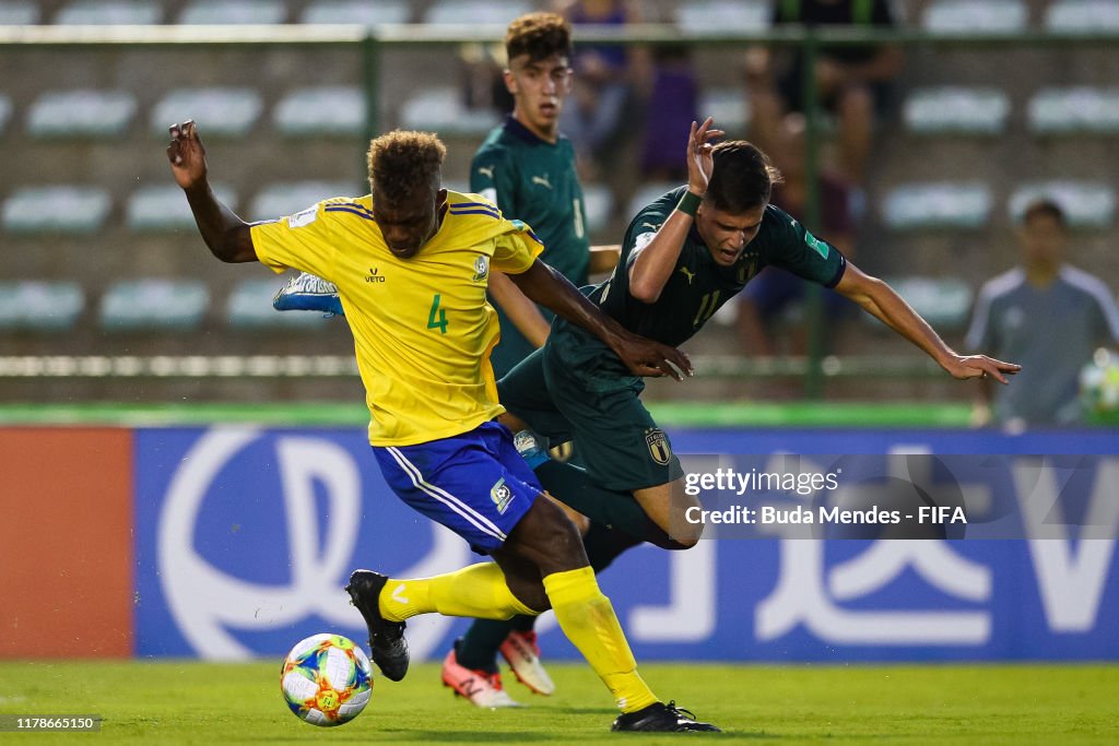 Leon Kofana of Solomon Islands struggles for the ball with Nicolo