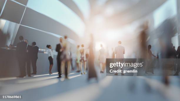 crowds of people walking on futuristic street - office motion stock pictures, royalty-free photos & images