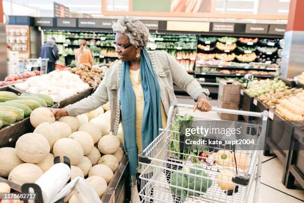 senior woman and grocery shopping - older black people shopping stock pictures, royalty-free photos & images