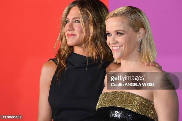 Actresses Jennifer Aniston and Reese Witherspoon arrive for Apples "The Morning Show" global premiere at Lincoln Center- David Geffen Hall on October...
