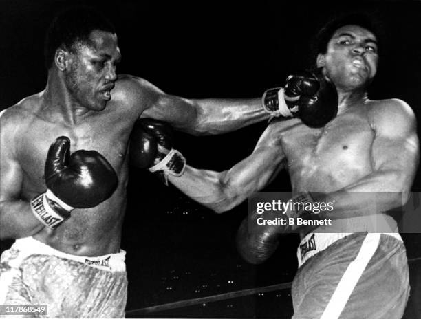 Joe Frazier lands a punch on Muhammad Ali during their heavyweigh fight in Madison Square Garden on March 8, 1971 in New York City. Frazier defeated...