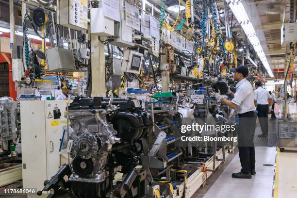 Employees work on engines at the Sunter 1 Plant, an engine manufacturing facility operated by PT Toyota Motor Manufacturing Indonesia , a subsidiary...