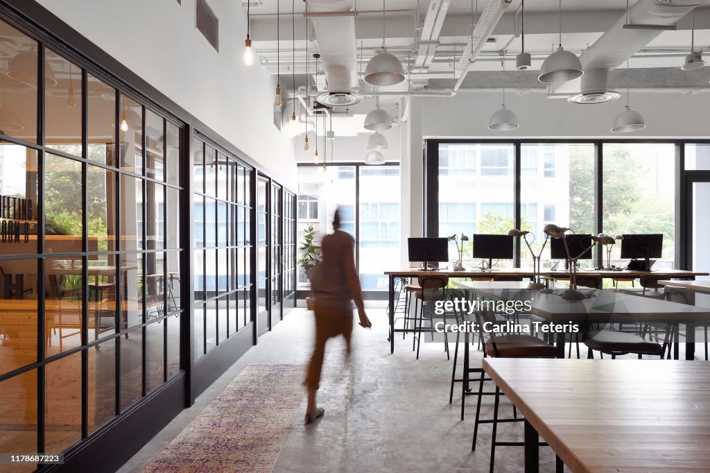 Woman walking through a co-working office