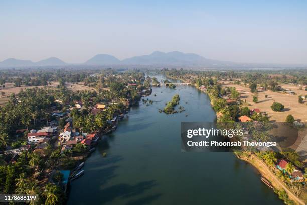 an aerial view of old french railway bridge that connect don det and don khon, khong district, champasak province, laos - river mekong stockfoto's en -beelden