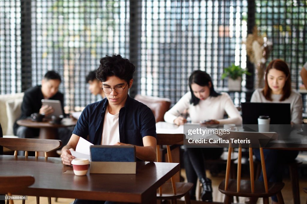 Group of Singaporeans working in a co-working office