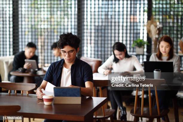 Group of Singaporeans working in a co-working office