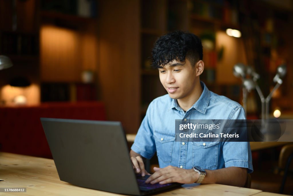 Young man working in a co-working office