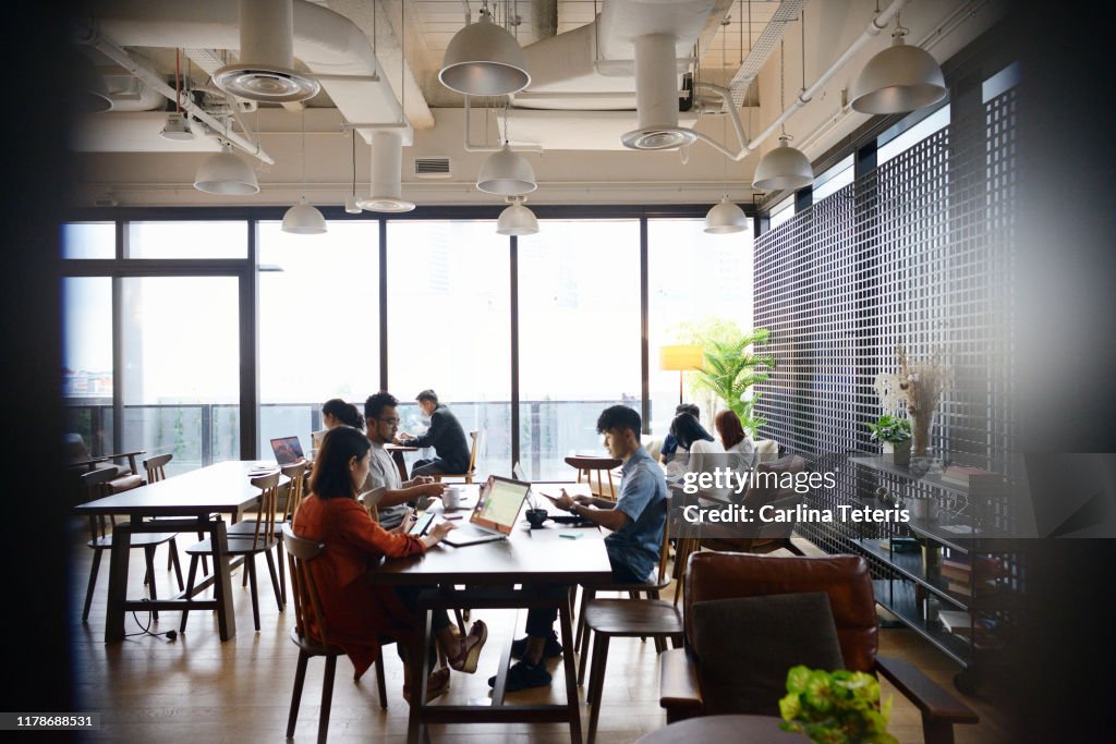 Group of people working in a modern co-working office