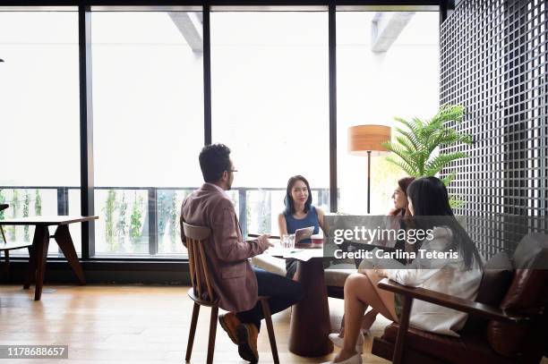 business meeting in a lounge - global cultures stock pictures, royalty-free photos & images