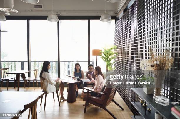 Woman leading a meeting in a co-working office