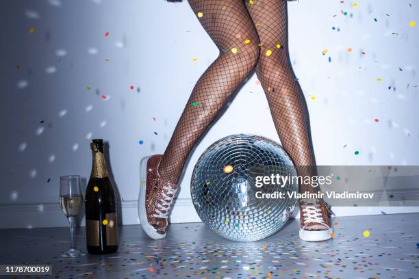 party details of female legs and disco ball - legs show stock pictures, royalty-free photos & images