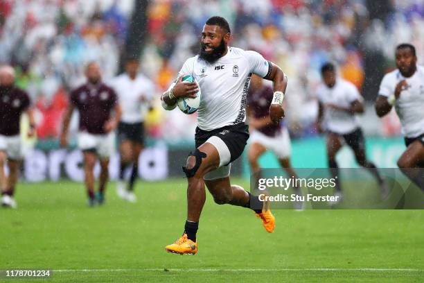 Waisea Nayacalevu of Fiji runs with the ball as he goes on to score his team's first try during the Rugby World Cup 2019 Group D game between Georgia...