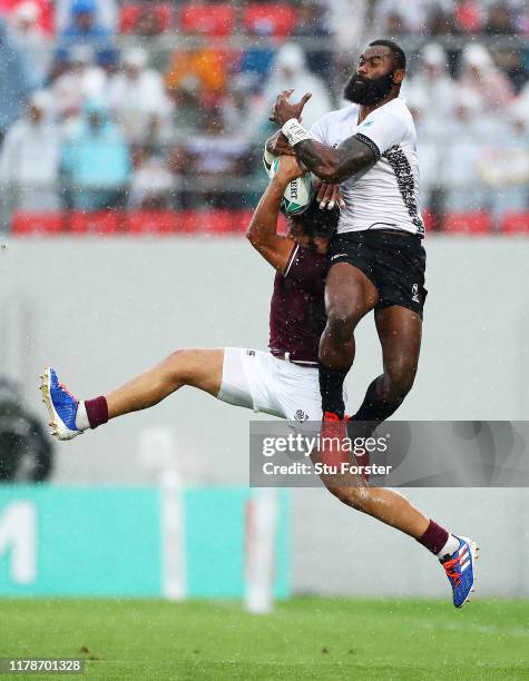Semi Radradra of Fiji competes in the air for the ball with Giorgi Kveseladze of Georgia during the Rugby World Cup 2019 Group D game between Georgia...