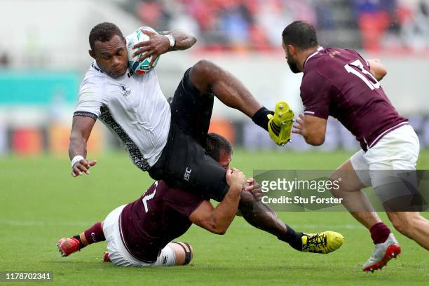 Leone Nakarawa of Fiji is tackled by Merab Sharikadze of Georgia during the Rugby World Cup 2019 Group D game between Georgia and Fiji at Hanazono...
