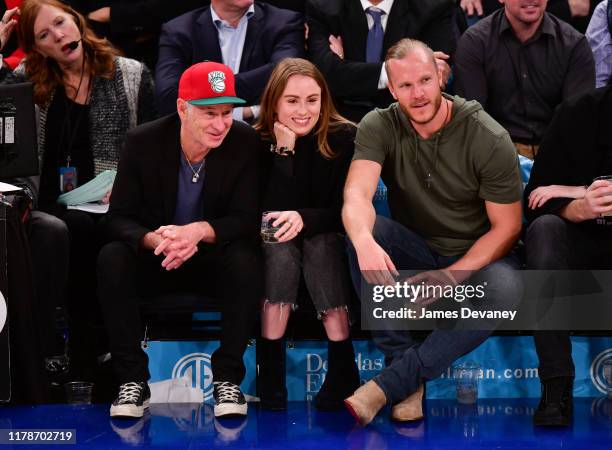 John McEnroe, Anna McEnroe and Noah Syndergaard attend Chicago Bulls v New York Knicks game at Madison Square Garden on October 28, 2019 in New York...