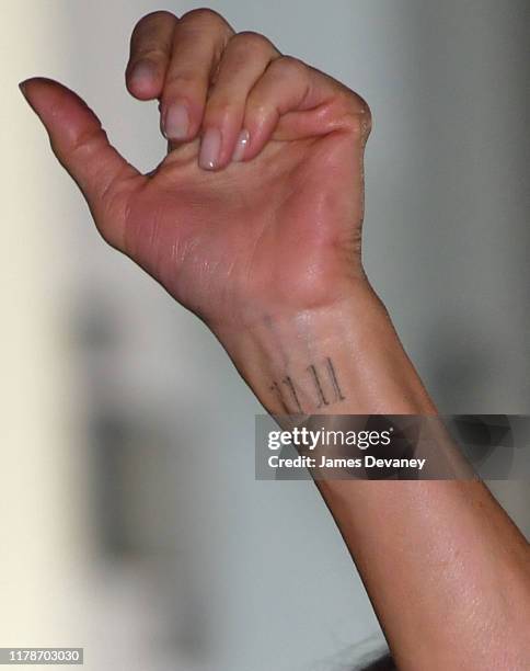 View of Jennifer Aniston's tattoo on her wrist at Apple's "The Morning Show" premiere at Lincoln Center on October 28, 2019 in New York City.