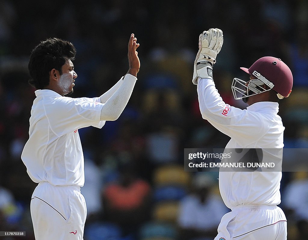 Bishoo West Indies bowler Devendran Bishoo celebrates with Carlton Baugh ...