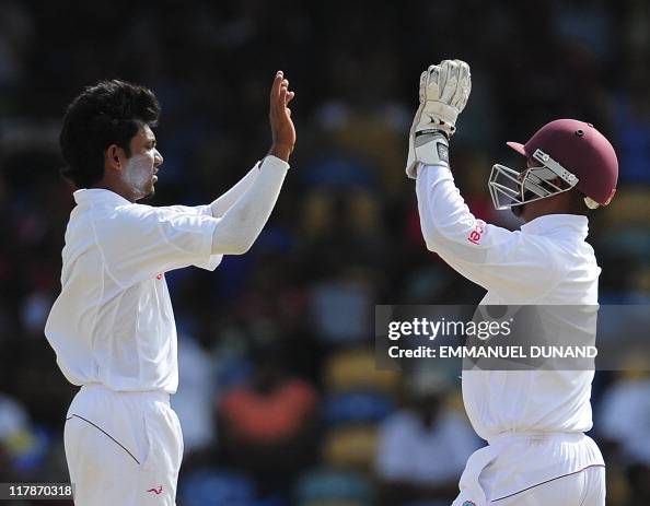 Bishoo West Indies bowler Devendran Bishoo celebrates with Carlton Baugh ...