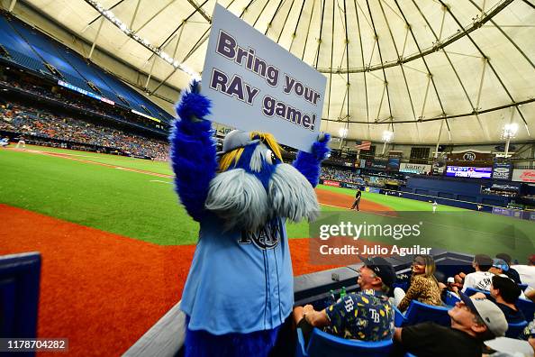 The Tampa Bay Rays mascot Raymond holds up a sign during a game... News ...