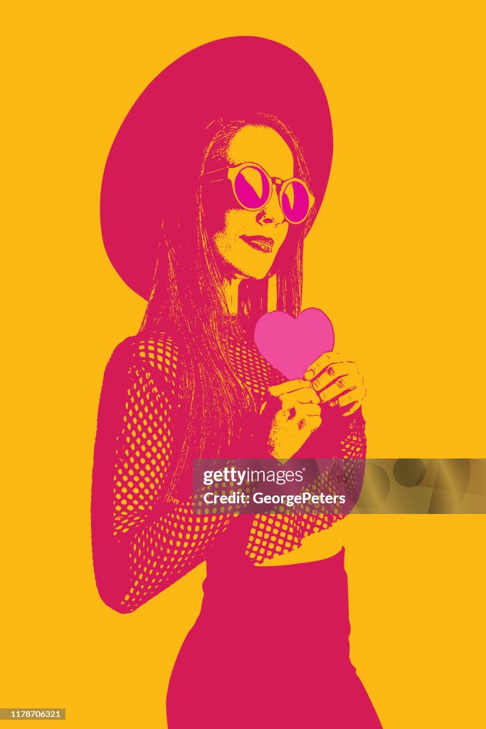 Fashionable woman holding heart and flirting