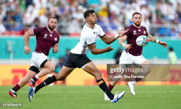 Ben Volavola of Fiji offloads the ball during the Rugby World Cup 2019 Group D game between Georgia and Fiji at Hanazono Rugby Stadium on October 03,...