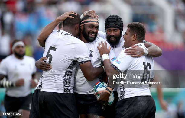 Apisalome Ratuniyarawa of Fiji celebrates with teammates after scoring his team's sixth try during the Rugby World Cup 2019 Group D game between...